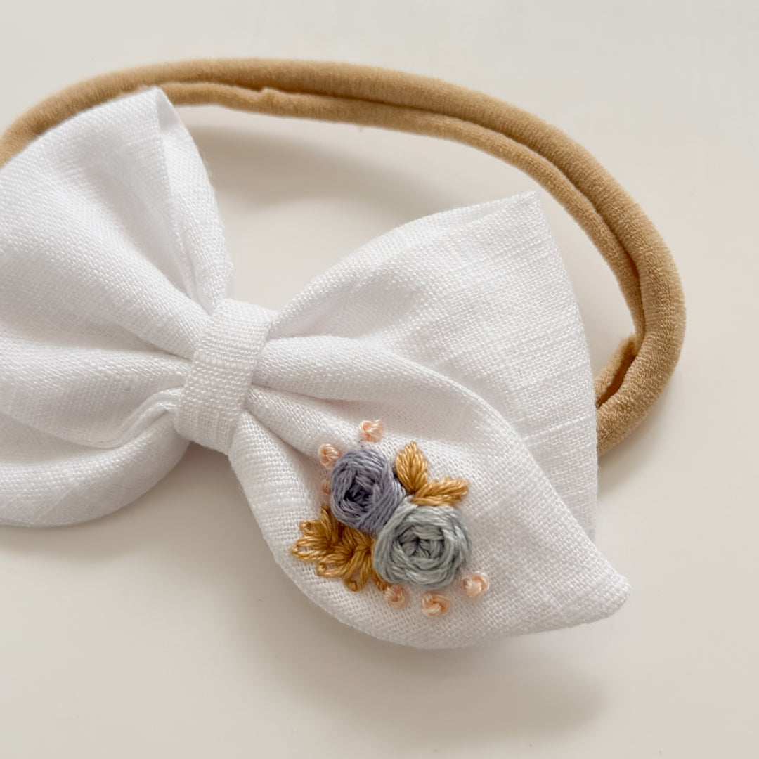 White + blue embroidered roses